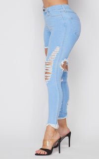 Vibrant All-Over Distressed Denim Skinny Jeans - Light Denim - SohoGirl.com